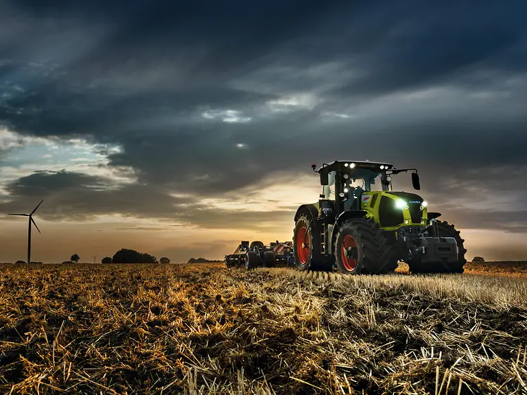 tractor working in the field at night